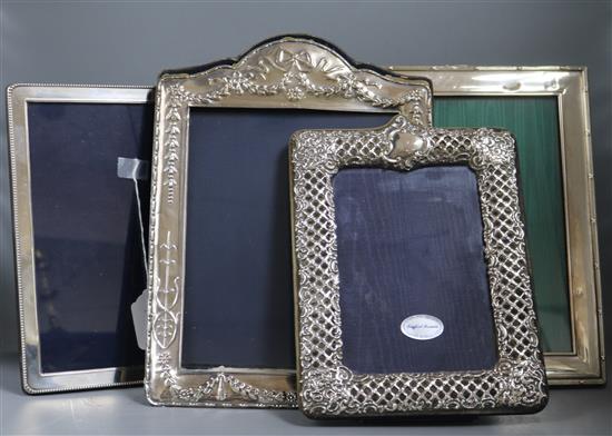 Four assorted large modern silver mounted photograph frames including Harrods Ltd, largest 36cm.